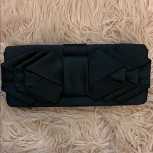 Sondra Roberts black bow clutch